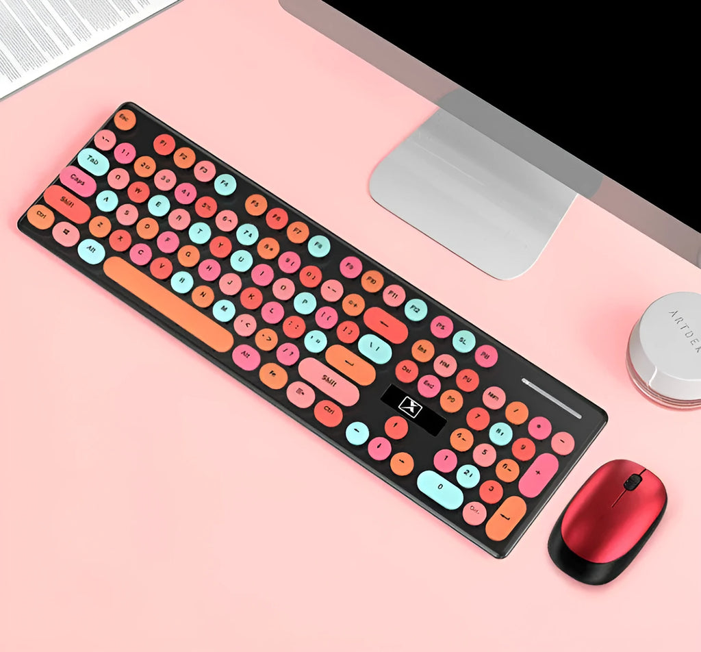 Vibrant yellow wireless keyboard and mouse set with multi-colour backlighting on a desk.