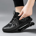 Black Tech running shoes with mesh upper, buckle fastening, and rubber sole on a white background.