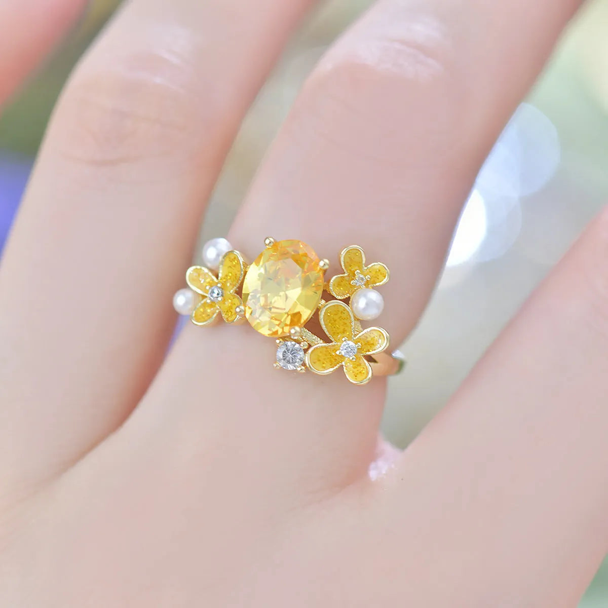 Women's open ring with floral zircon stones in light purple electroplated metal
