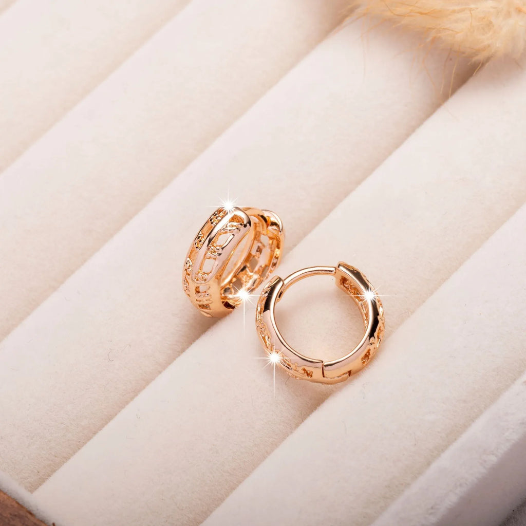 Rose gold copper earrings with hollowed-out leaf design featuring heart shape details