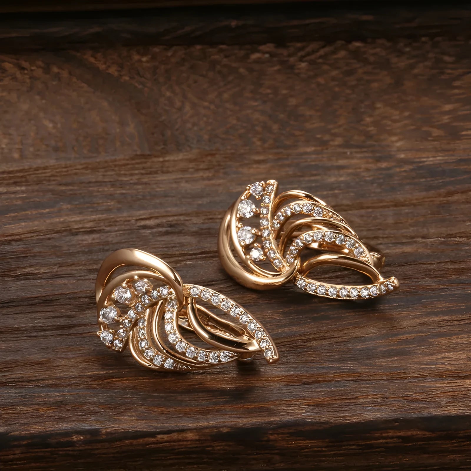 Gold-plated U-shaped ear clasps with wing design featuring micro-inlaid artificial gemstones