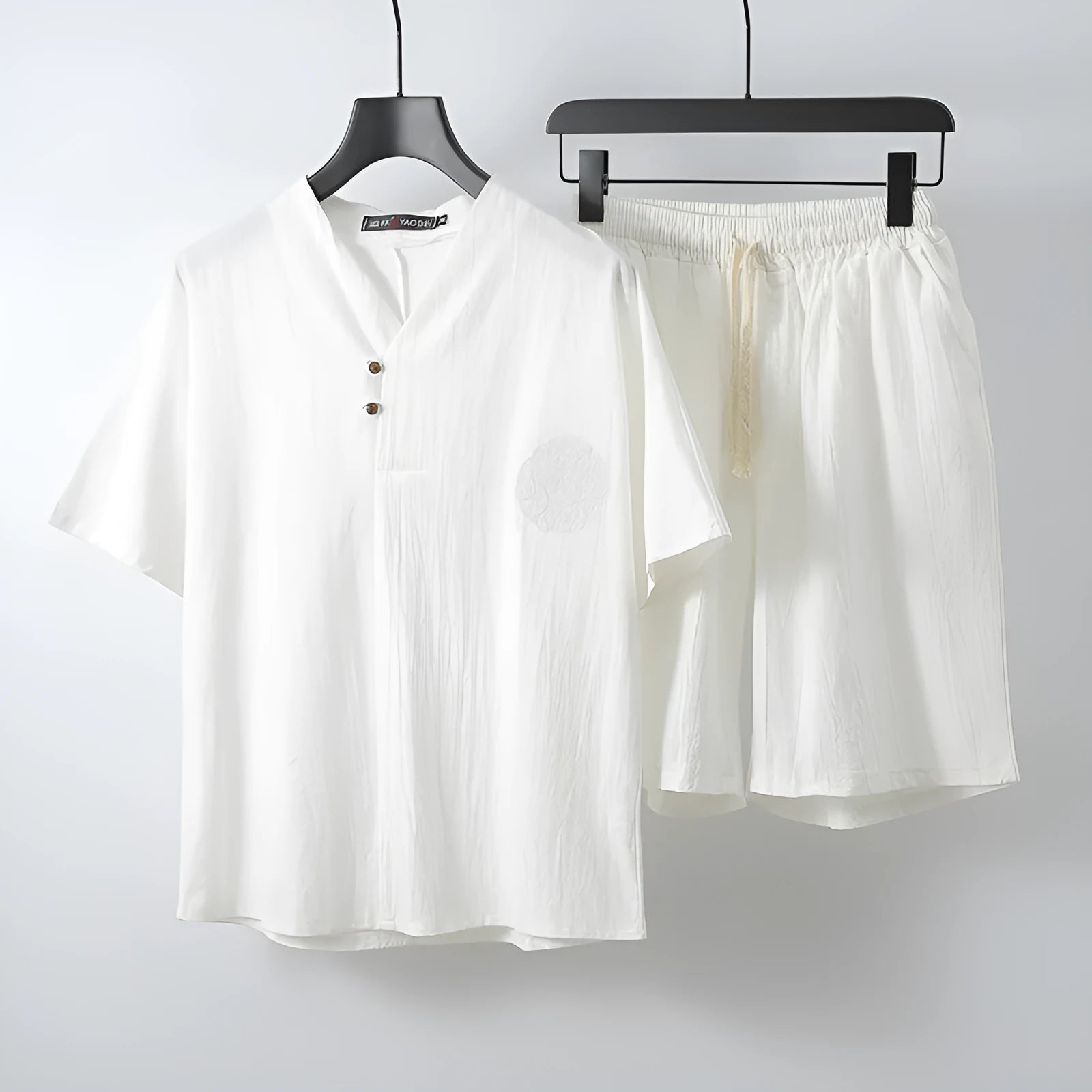 Men's loose fit linen two-piece set with short sleeve top and matching shorts