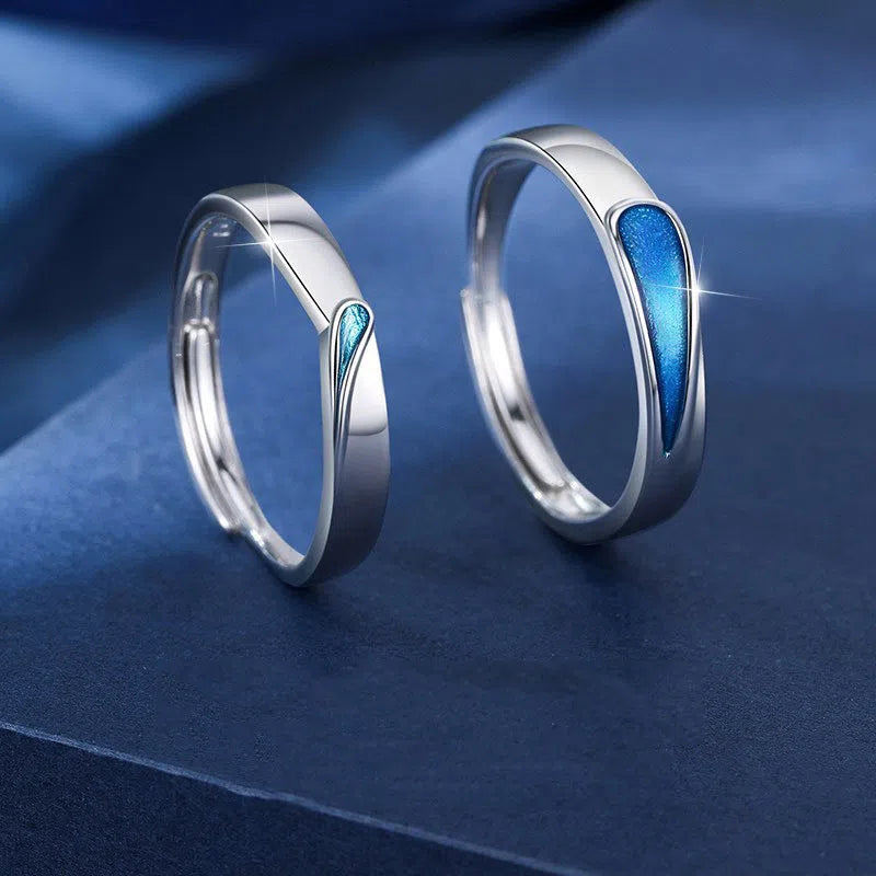 Blue tear drop shape copper ring on finger with glossy glue dripping finish