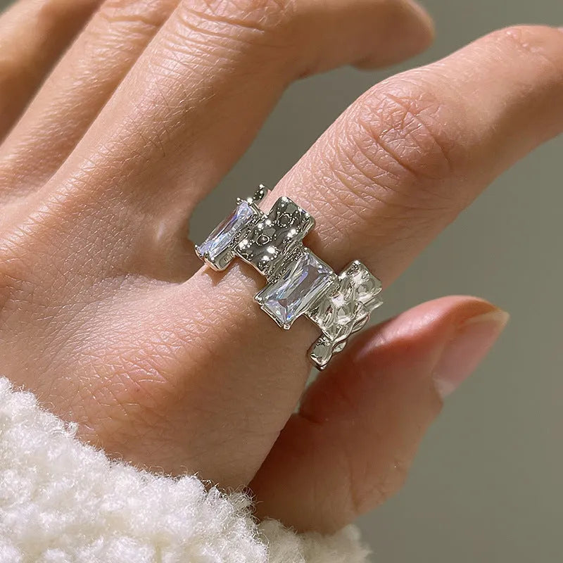 Geometric open design zircon ring in silver-plated metal with retro styling
