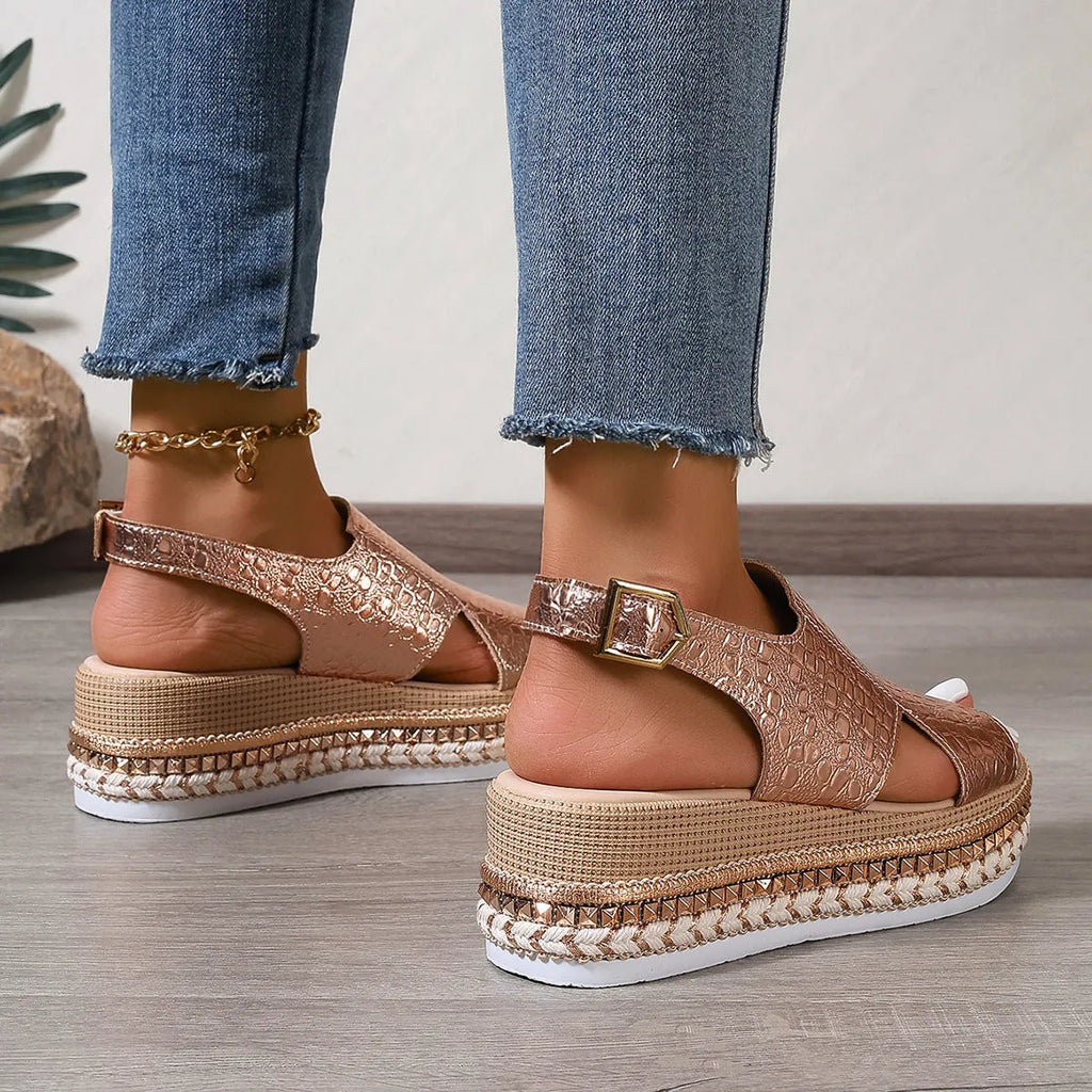 Gold women's Roman sandals with round toe, hollow-out design, and adjustable ankle buckle