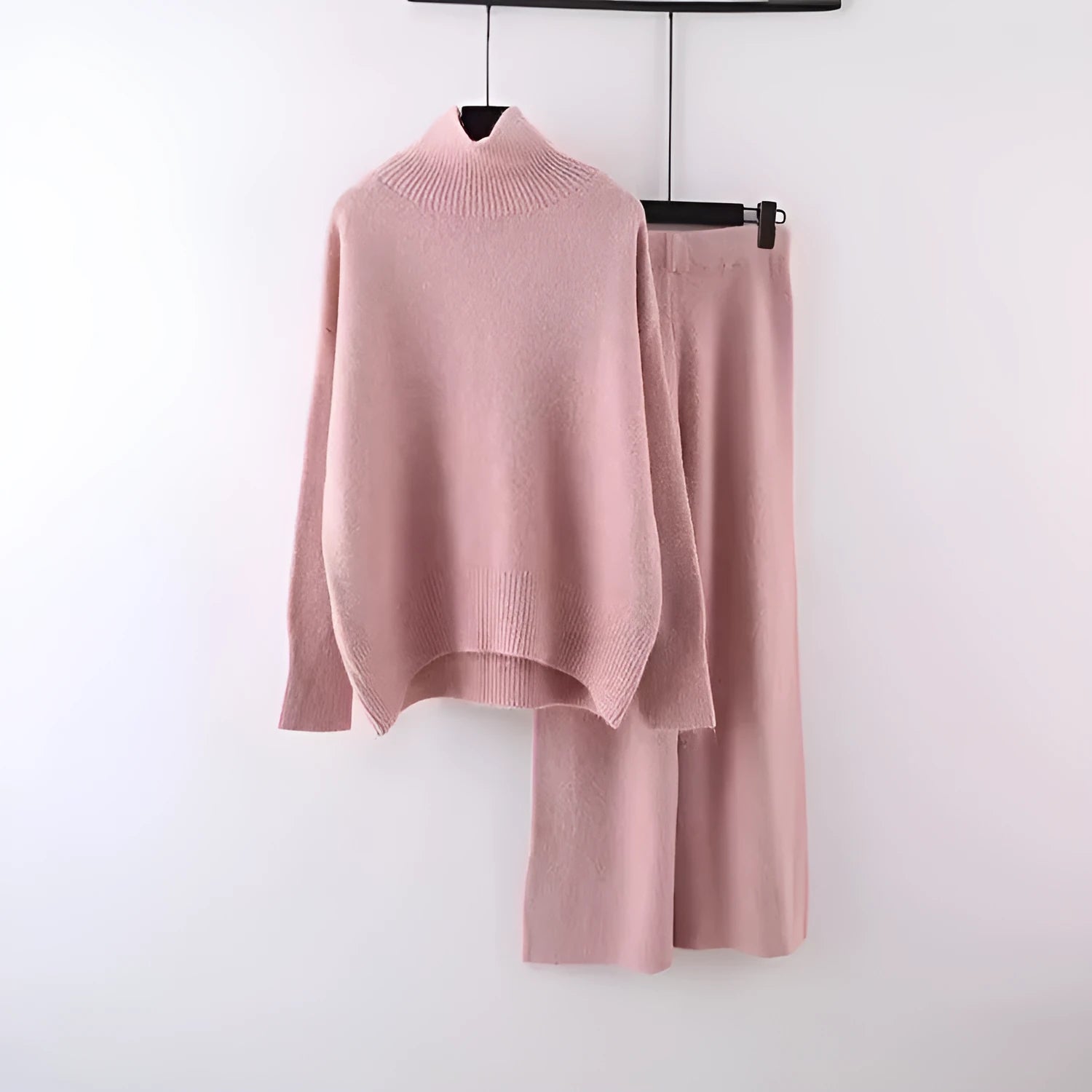 Women's beige acrylic fibre sweater and wide-leg trousers two-piece set on a hanger.