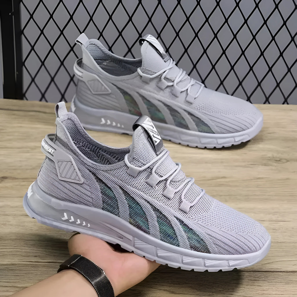 Low-top mesh sneaker with plastic sole in black colour showing striped pattern and flat heel design