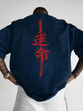 Men's loose fit combed cotton printed t-shirt in black with orange print, short sleeve pullover