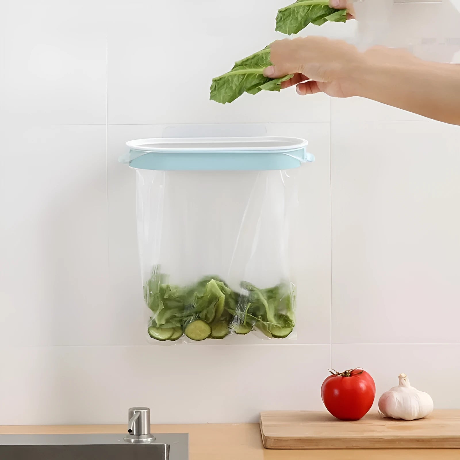 Blue plastic kitchen garbage bag storage rack for organising bin liners under sink cabinets