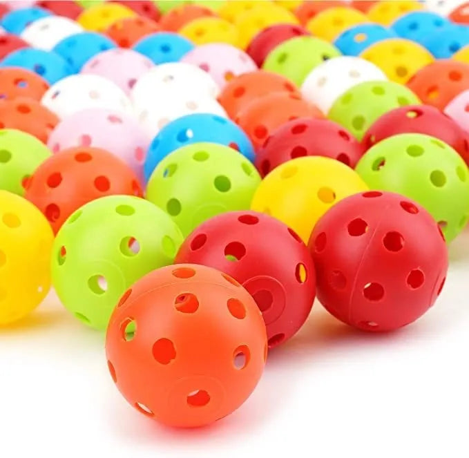 Multi-colour 42mm golf practice balls with a 26-hole surface design in a net pocket.