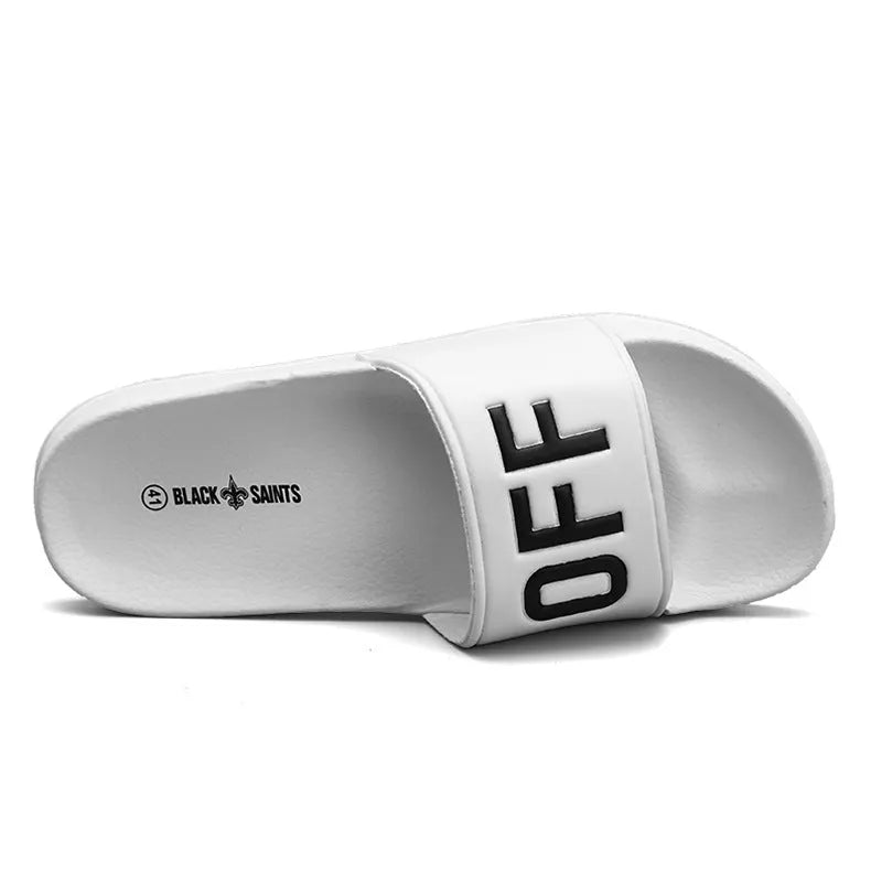 Men's large black and white open-toe personalised slippers with rubber soles on a plain background.