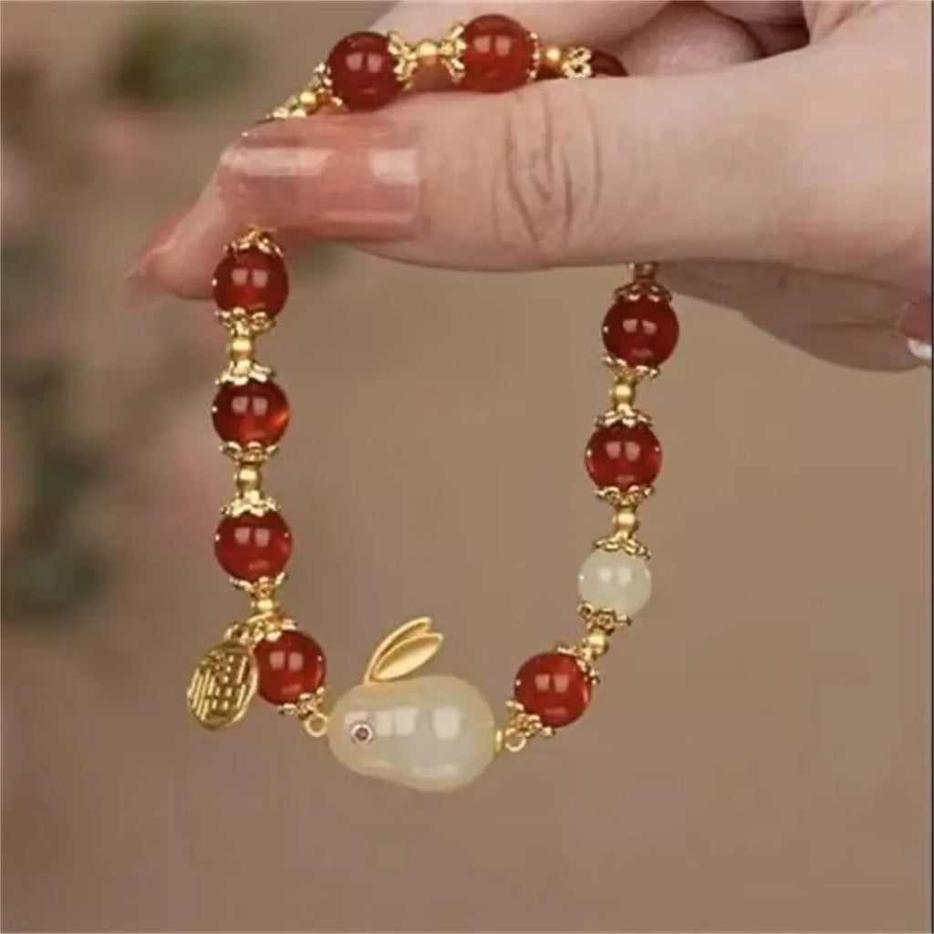 Peace buckle bracelet with rabbit motif, glass and coloured glaze beads