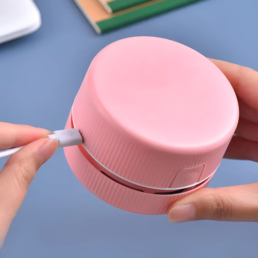 Portable mini desktop vacuum cleaner for pencil chips in pink colour with rechargeable battery