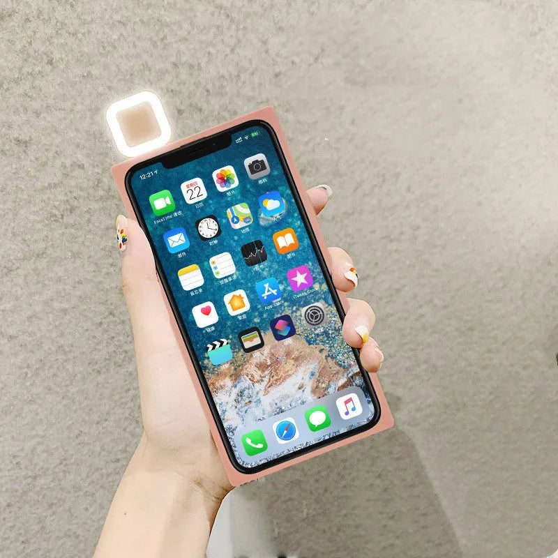 Ring flashing mobile phone case for iPhone 13 with solid colour back cover and integrated selfie light.