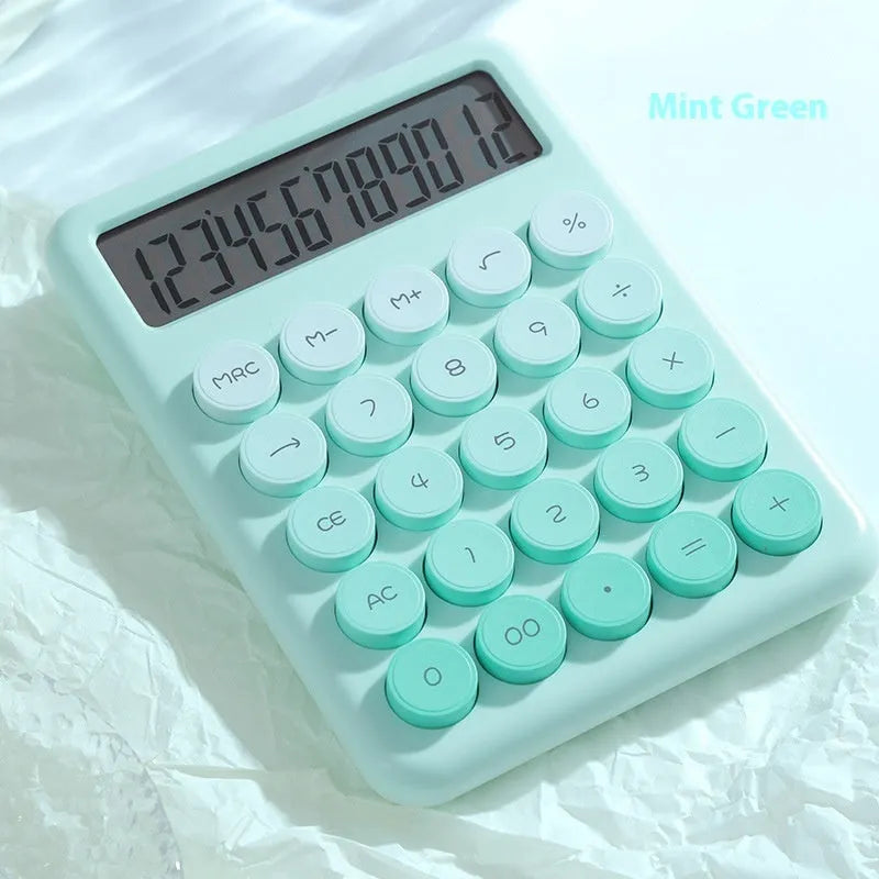 12-digit gradient colour desktop calculator in violet, blue, green, or pink on a desk