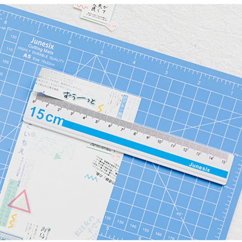 Art pen knife cutting board set in chosen colour with backing board, ruler, pen sharpener, and blade.