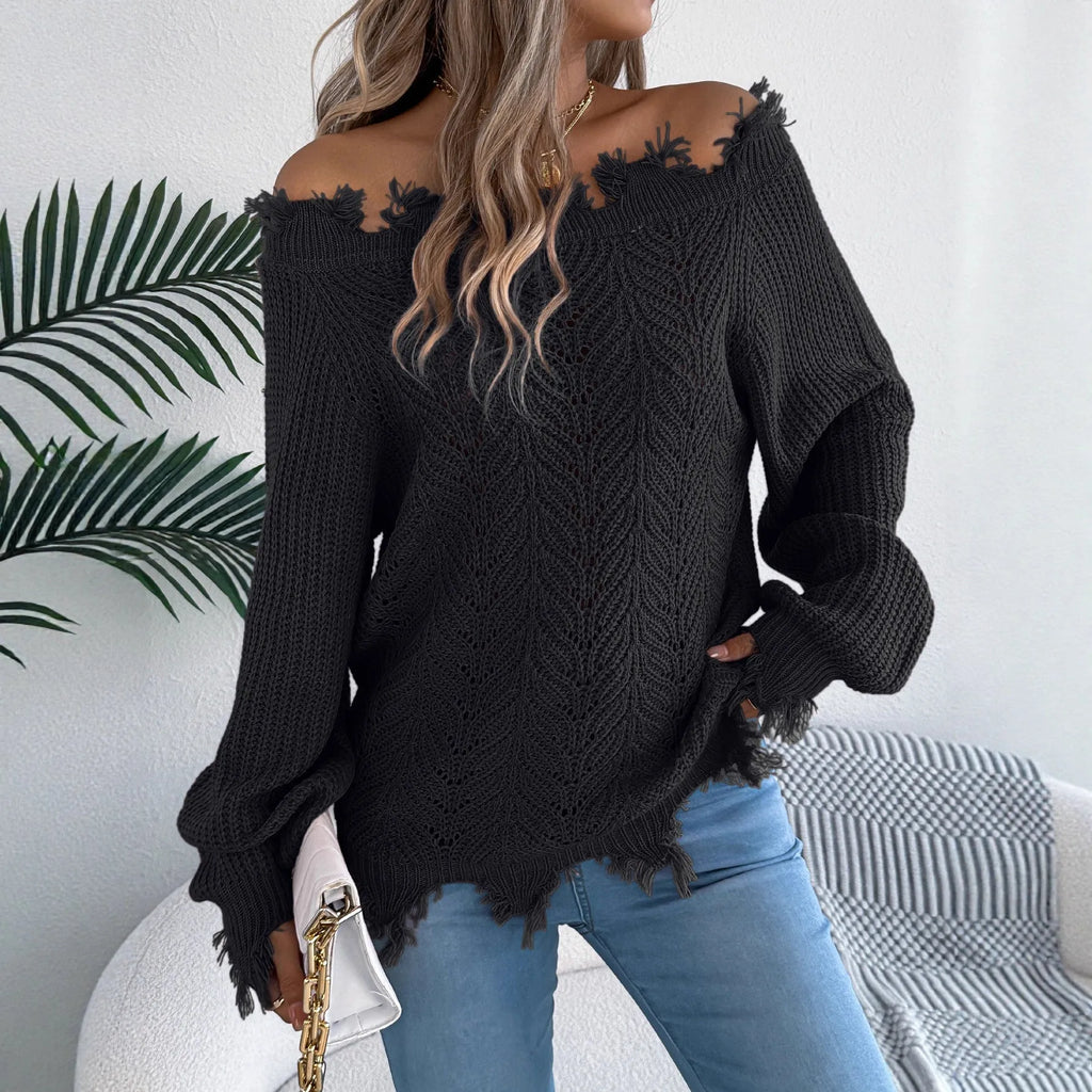 White hollow-out long-sleeved pullover sweater with an off-the-shoulder cut and regular sleeves on a hanger.