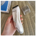 White children's barber scissors set with comb, limit combs, host, oil bottle, and brush