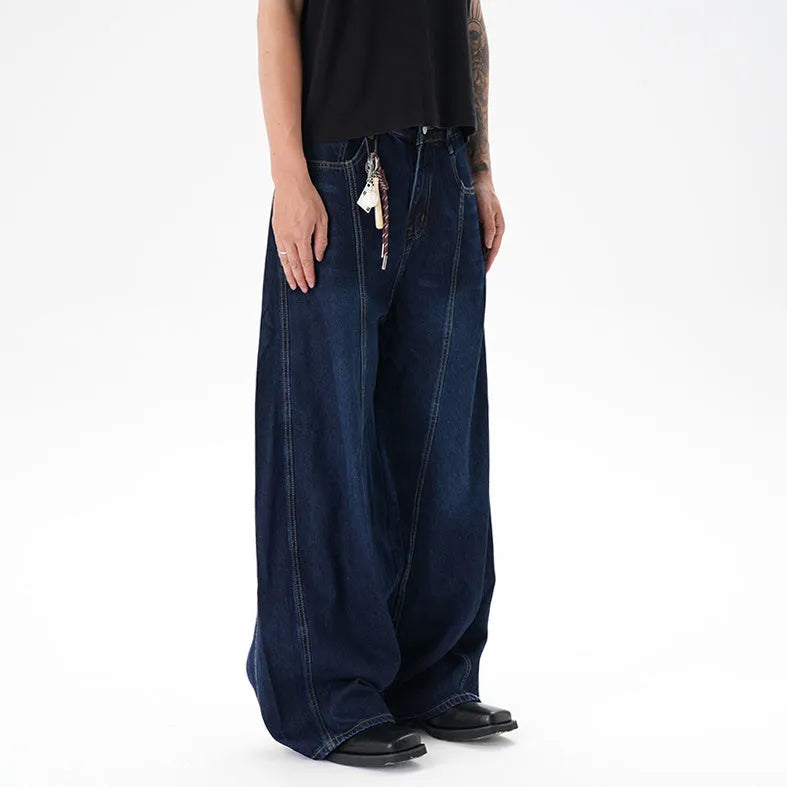 Dark blue women's wide-leg denim jeans with distressed detailing on the legs.