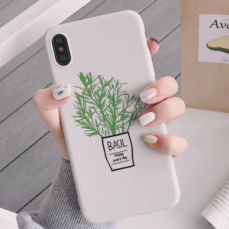 White silicone iPhone case with a detailed green plant pattern on the back, showing full device coverage.