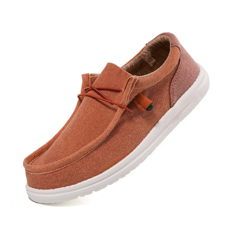 Men's green and orange canvas casual shoes with colourful mosaic panelling and rubber soles