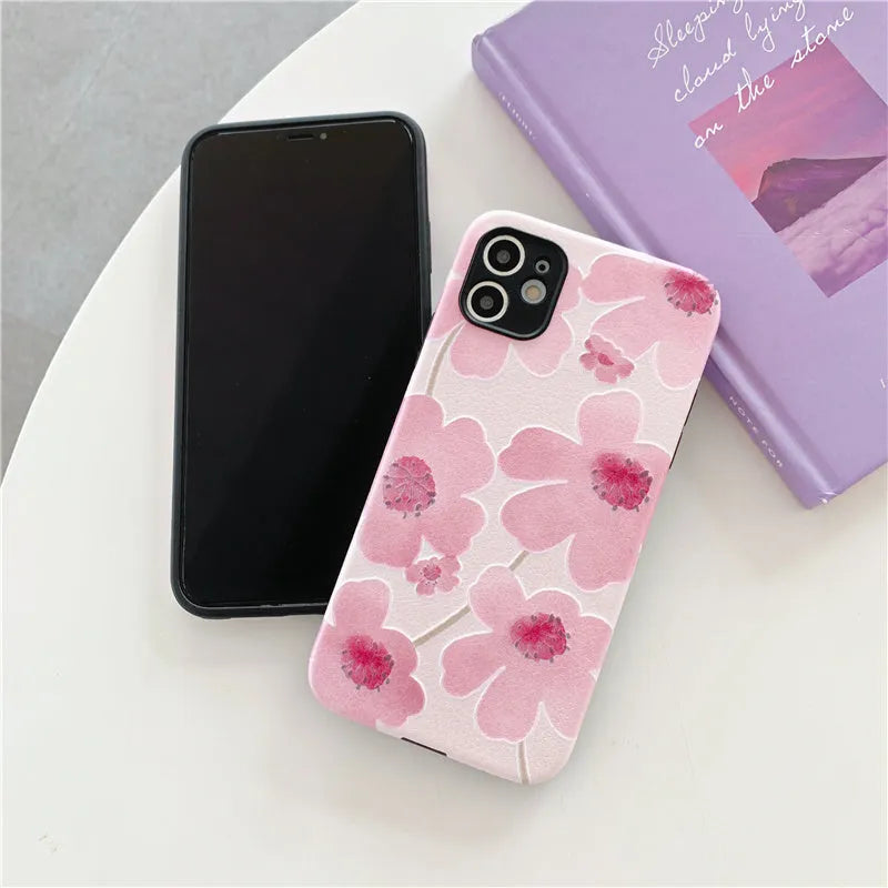 Pink soft rubber iPhone case with Japanese-Korean design showing lanyard hole