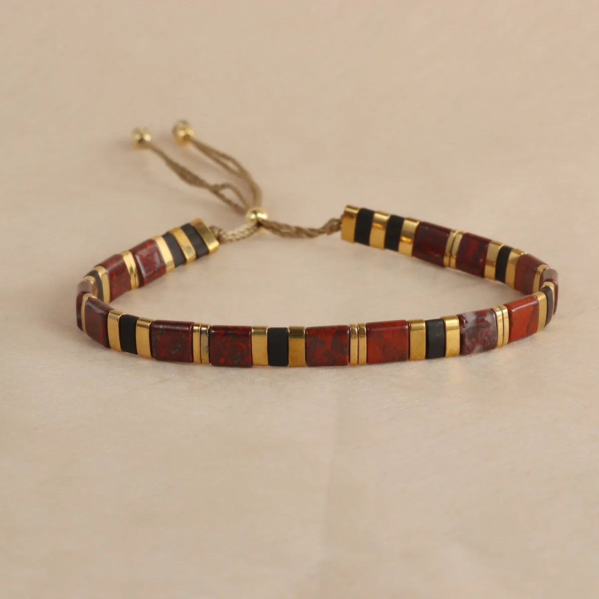 Geometric glass beaded bracelet in five colour options with pull beads adjustment