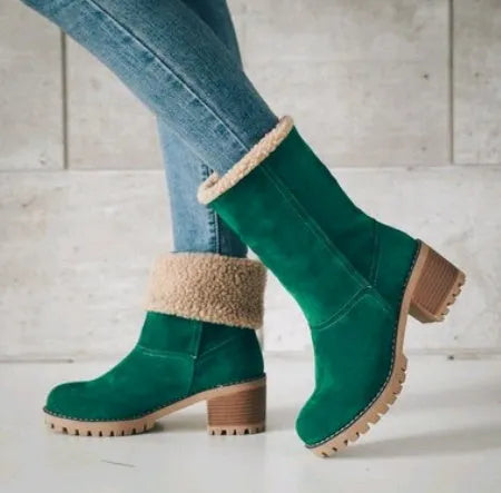 Women's suede mid-calf snow boots with thick flat sole in black, shown from the side.