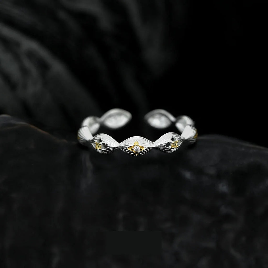 Buccherati brushed star ring in silver gold electroplated finish with adjustable opening on a white background