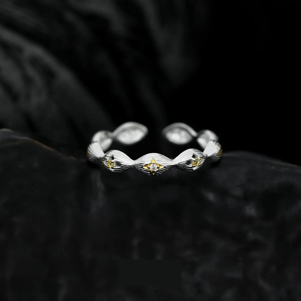 Buccherati brushed star ring in silver gold electroplated finish with adjustable opening on a white background
