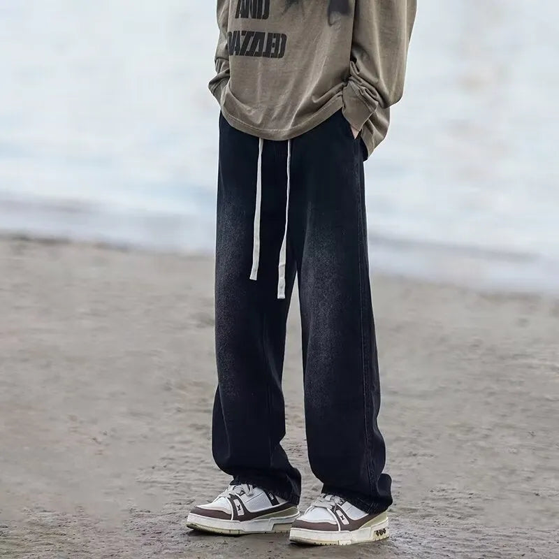 Men's straight-leg denim trousers in loose fit with drawstring waist closure