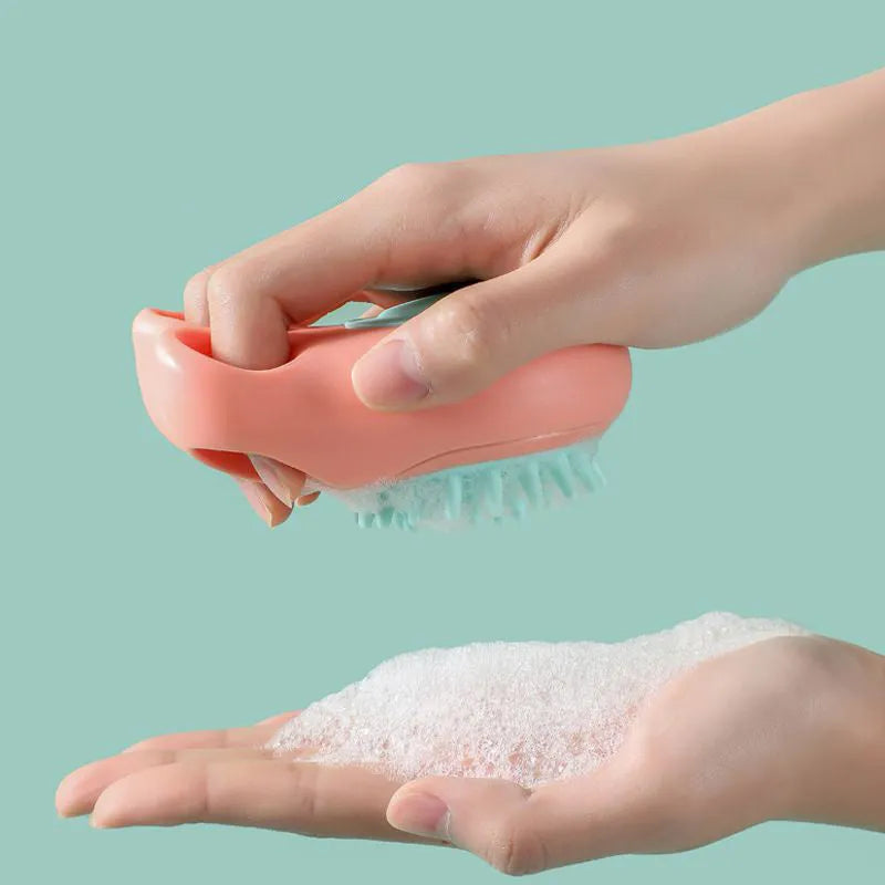 Blue silicone claw pet bath brush with non-slip handle for dog and cat grooming.