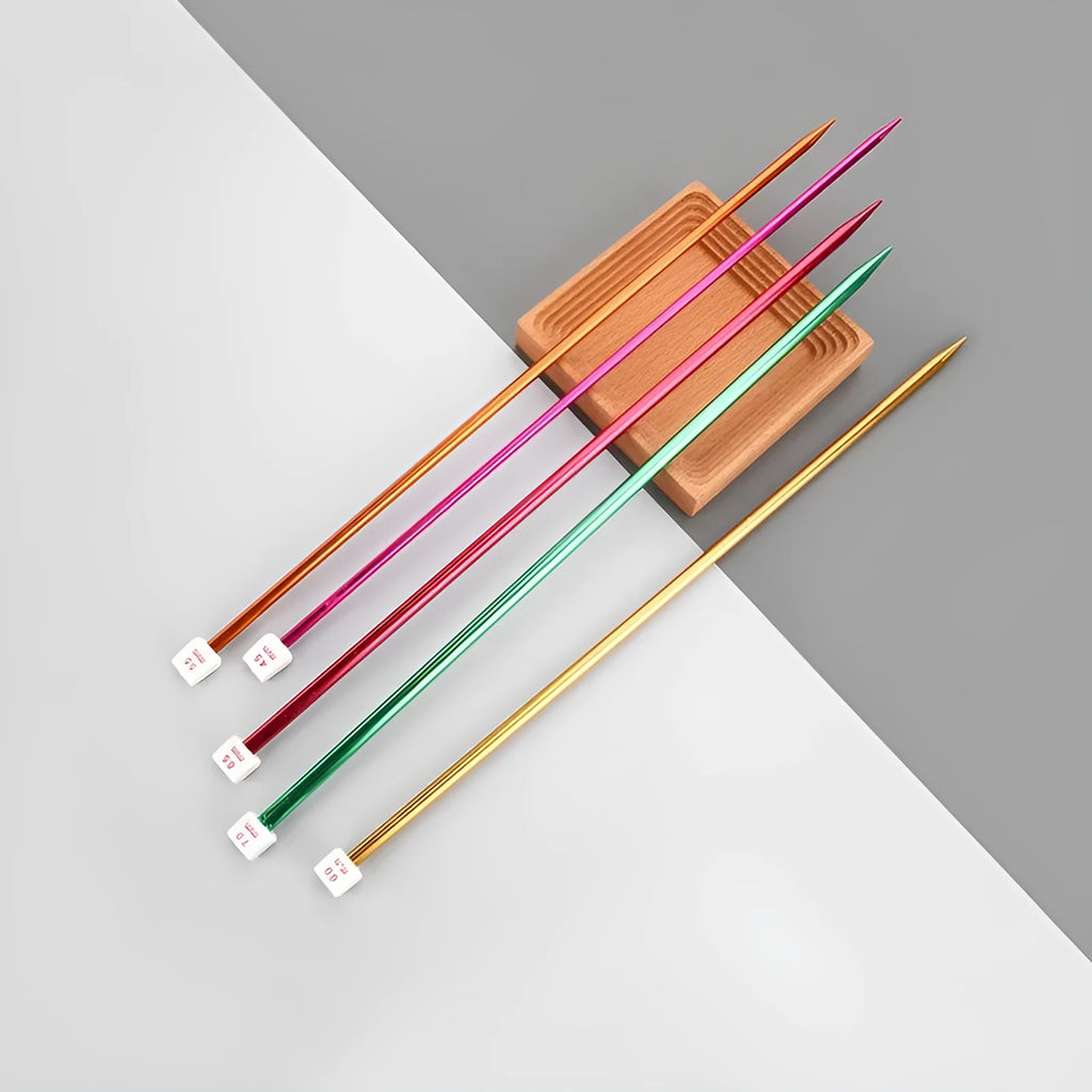 Set of lengthened crochet hooks with protective caps, showing hooks in various metric sizes from 2.0mm to 10.0mm.
