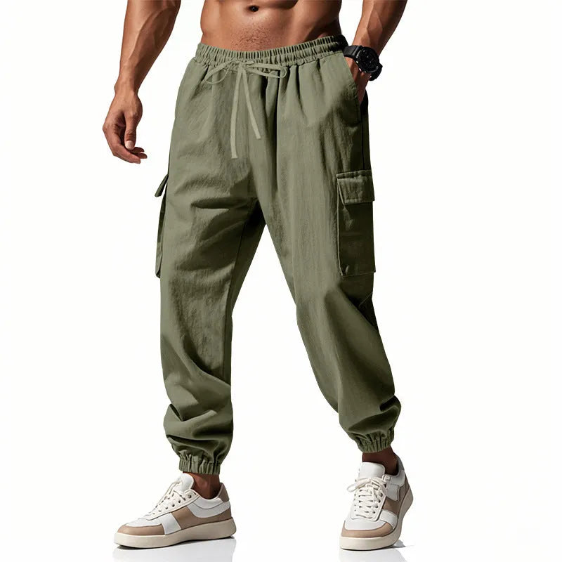 Men's solid colour linen casual trousers with ankle ties and multiple pockets in a loose fit.