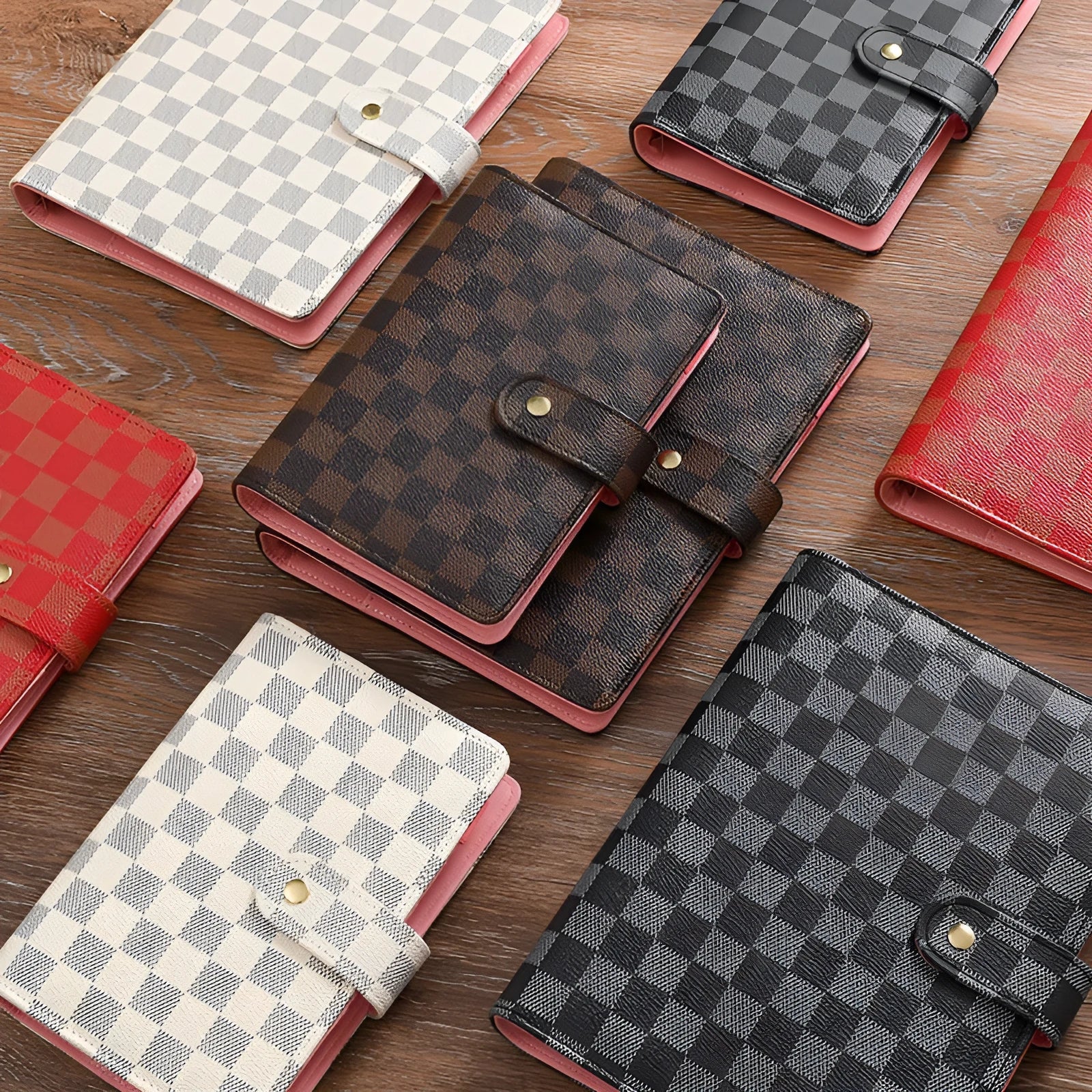 Loose-leaf checkered notebook with imitation leather cover in red, black, white or brown, showing ring binder and A5 size.