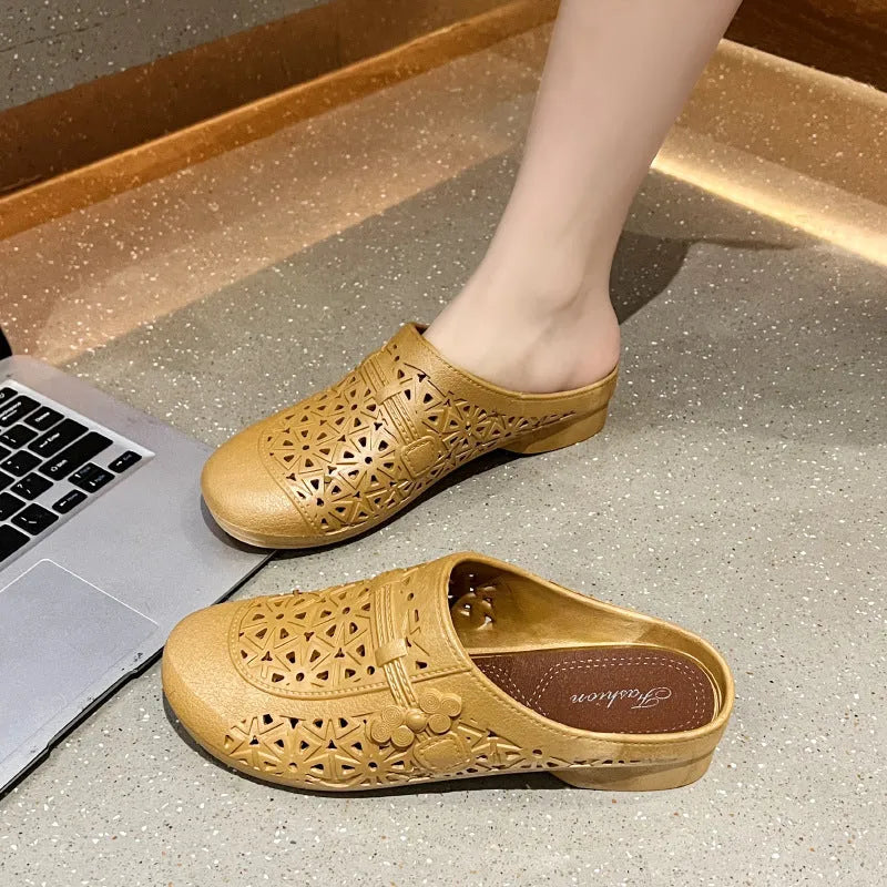 Adult flat toe box slippers in PVC with hollow-out design and faux fur collar.