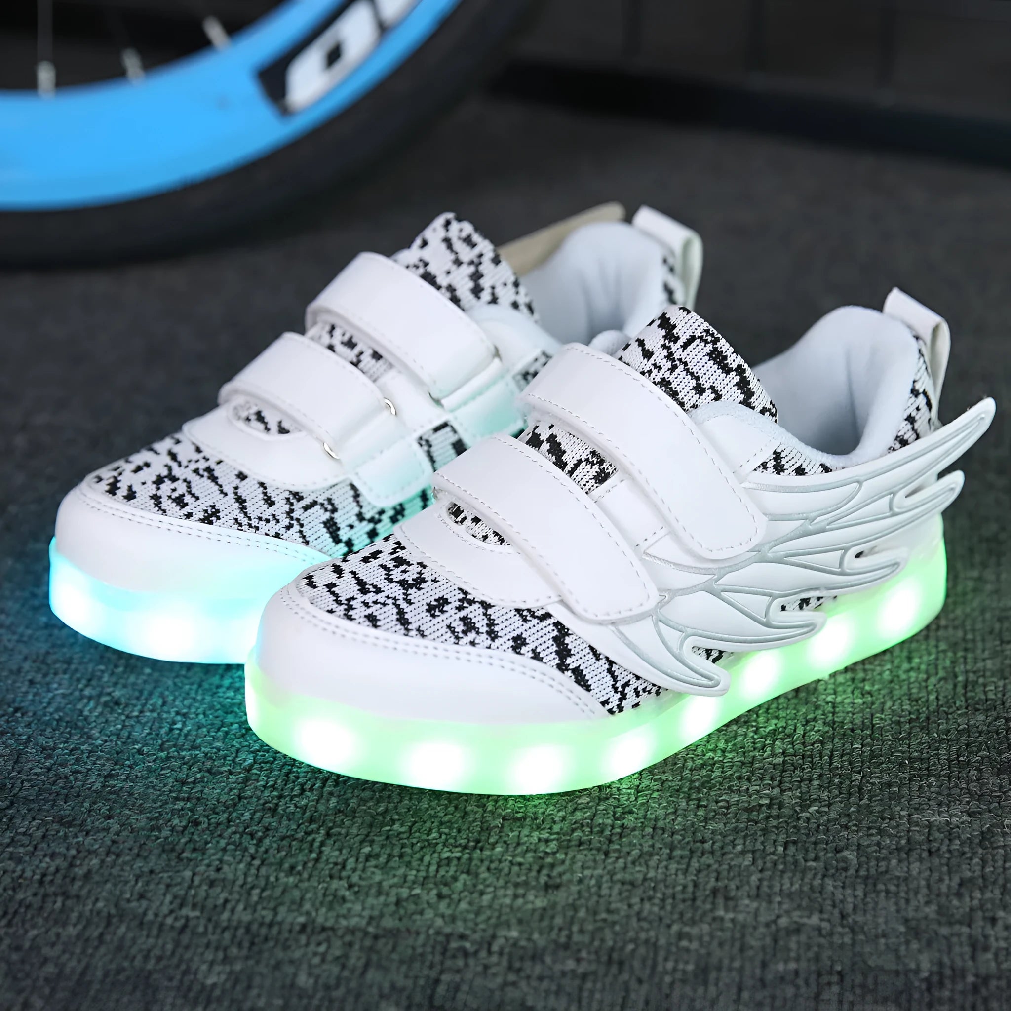 Children's plum red and white LED light-up sneakers with USB charging port.