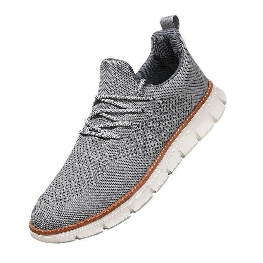 Men's grey and black casual sneakers with woven mesh upper and round toe.