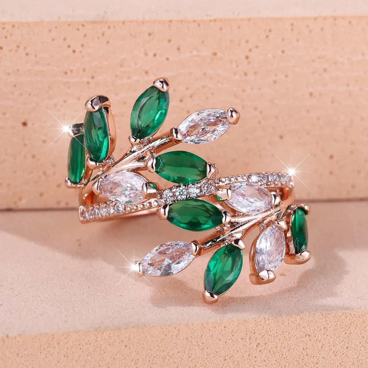 Copper leaf-shaped ring with horse eye design and zircon stones on a finger, showing adjustable opening.