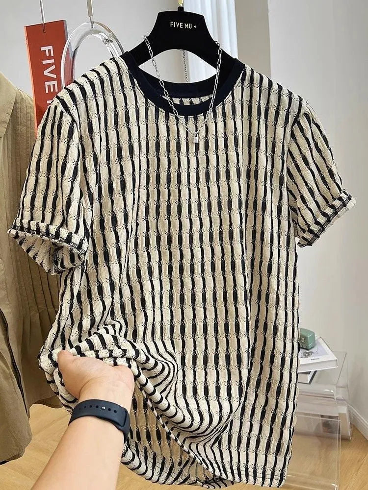 Black and white striped men's loose fit short sleeve pullover shirt made from linen silk blend fabric.