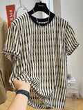 Black and white striped men's loose fit short sleeve pullover shirt made from linen silk blend fabric.