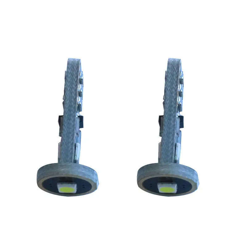 T10 W5W LED car light with blackboard white finish showing compact 23mm by 9mm dimensions