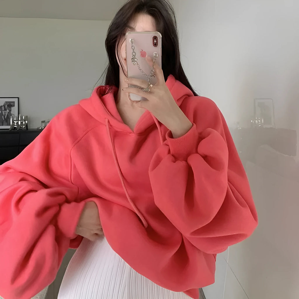Watermelon red women's sleeveless hooded sweater made from mulberry silk, shown loose fit.