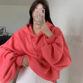 Watermelon red women's sleeveless hooded sweater made from mulberry silk, shown loose fit.