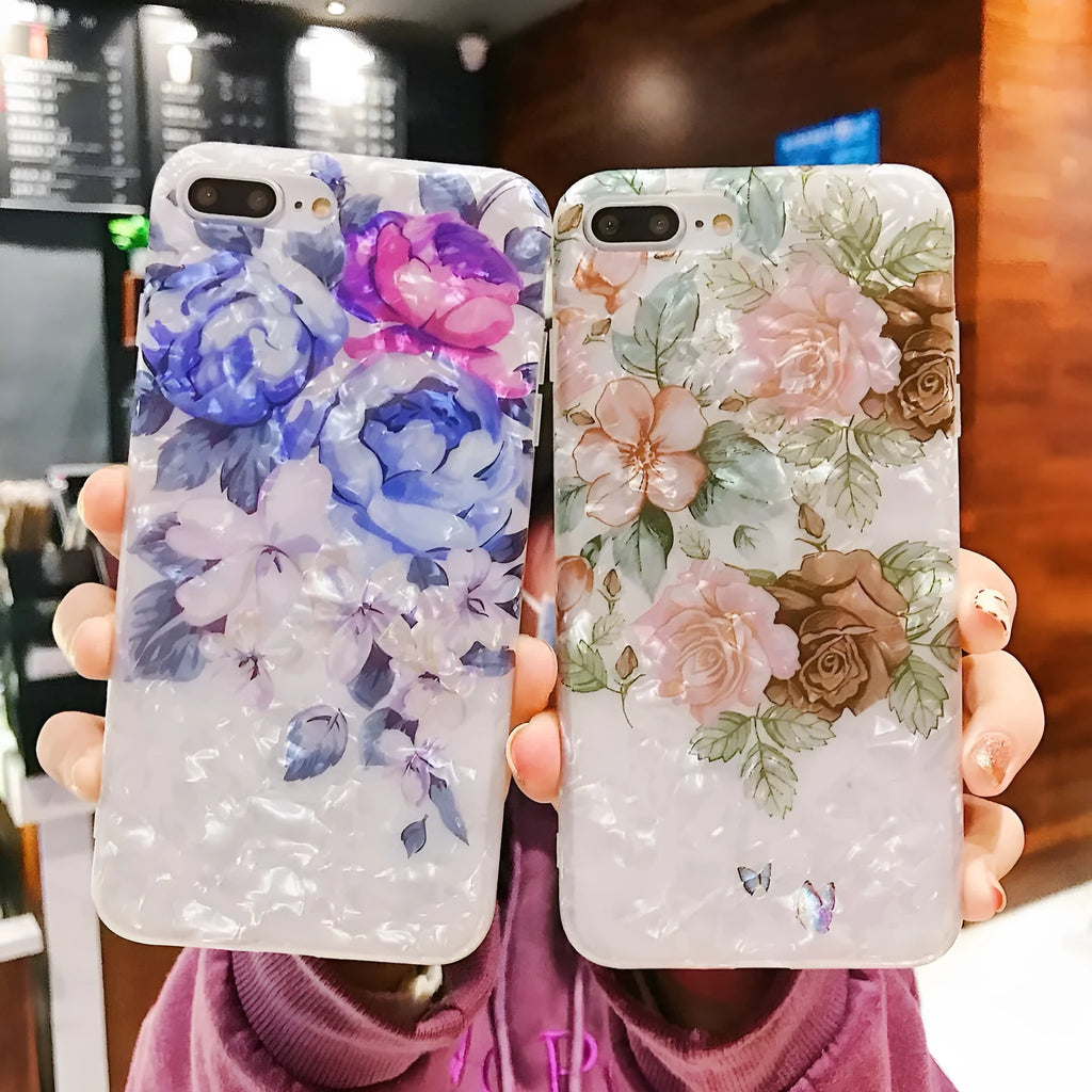 Dream Shell soft TPU iPhone case with rose flower pattern on back, shown in brown, purple and white.
