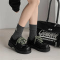 Big Head Derby men's and women's platform leather casual shoes with rubber sole on a neutral background.