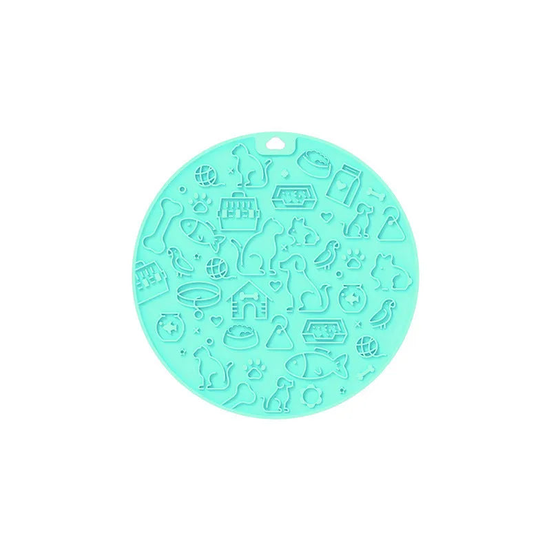 Round blue silicone pet licking mat with textured surface and a clear sucker base on the bottom.