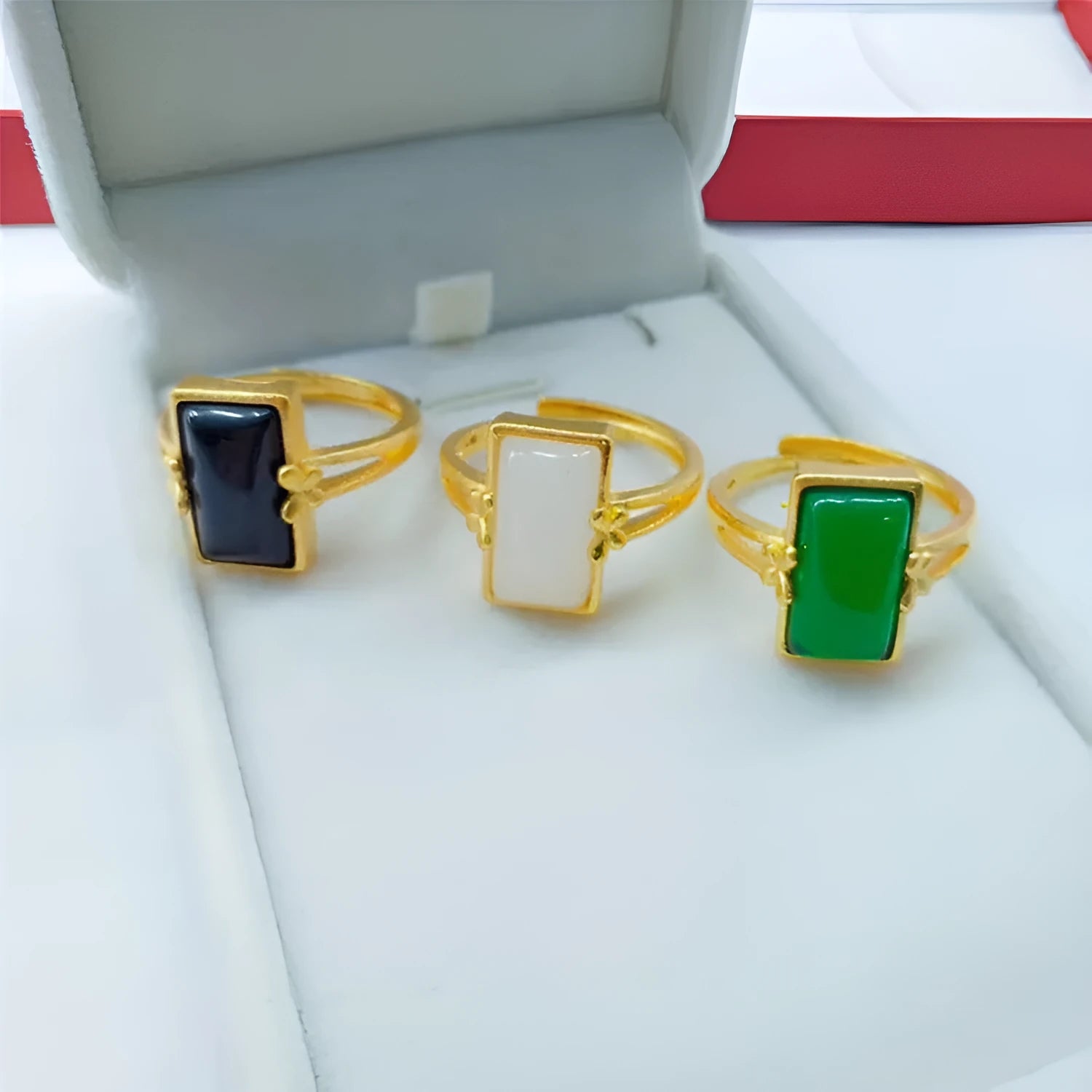 Adjustable brass gold-plated ring with a long green gemstone in a national style setting.