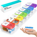 Large white plastic pill organiser with 14 removable compartments lined up next to the main case.