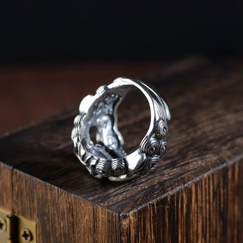 Silver open ring with jibeast pattern and diamond accents showing zodiac animal design